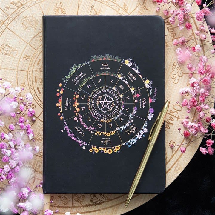A5 notebook with a Wheel of the Year design on the cover