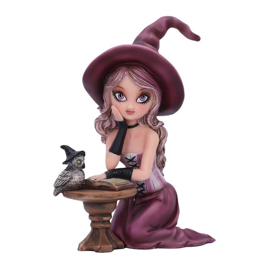 Kneeling witch figurine in purple skirt and witches hat with owl