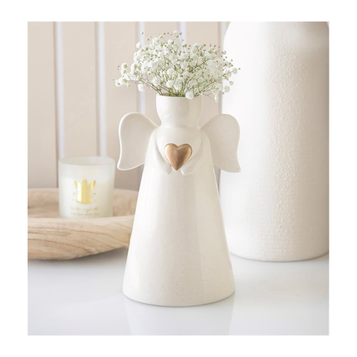 Off-white ceramic angel-shaped vase with wings and a gold heart