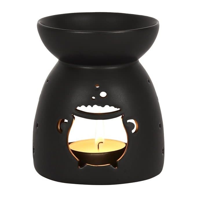 Matt black ceramic oil burner with a cut out cauldron design