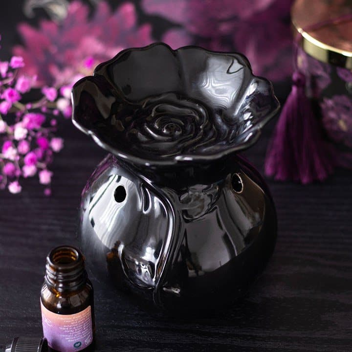 Ceramic oil burner sculpted as a dark rose in bloom