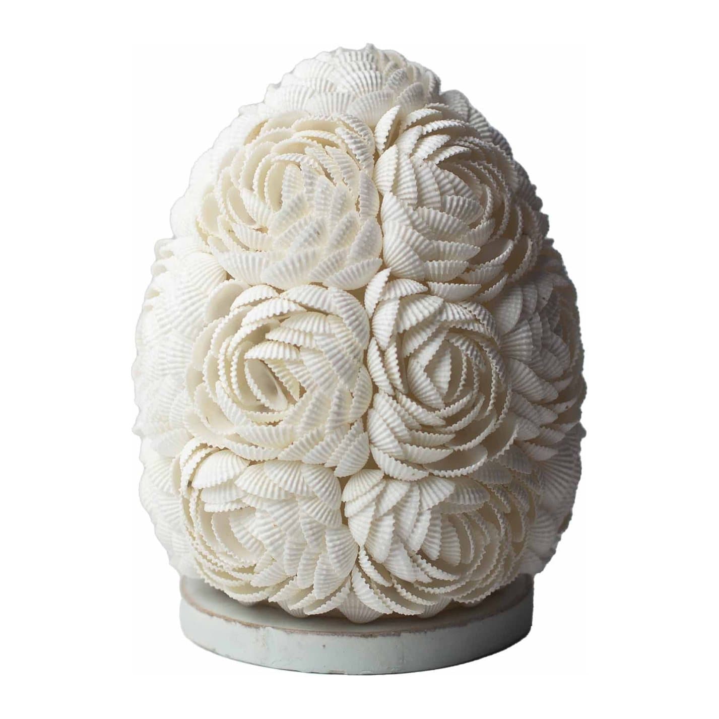 Handcrafted seashell lamp glowing softly