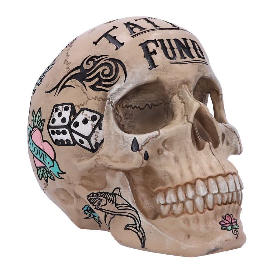 Bone coloured skull money box painted with colourful tattoo designs