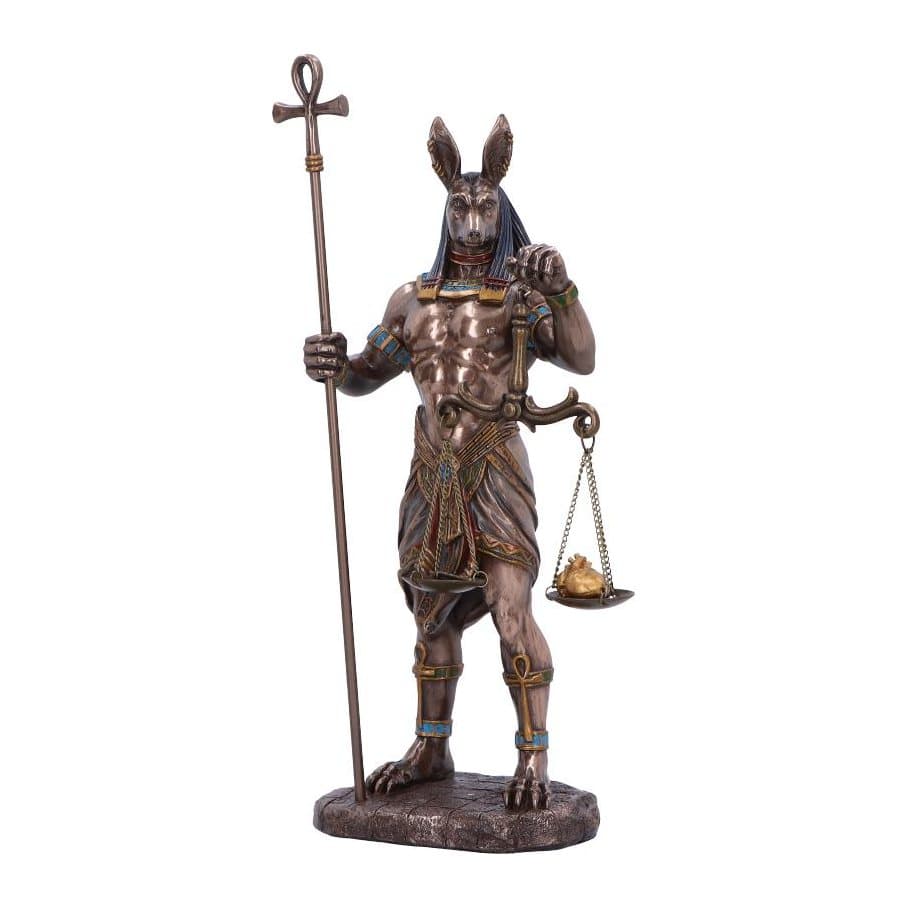 Bronzed Anubis figurine holding an ankh staff and the scale of justice