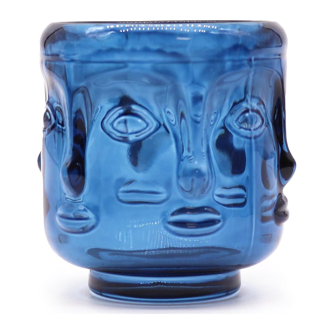 Pressed glass candle jar with a Buddha faces design