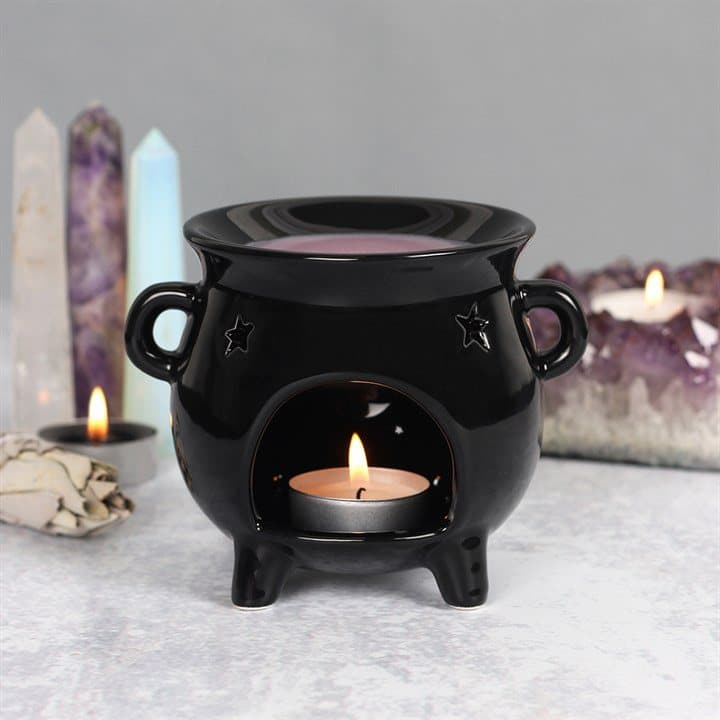 Black ceramic cauldron oil burner with cut-out star detail
