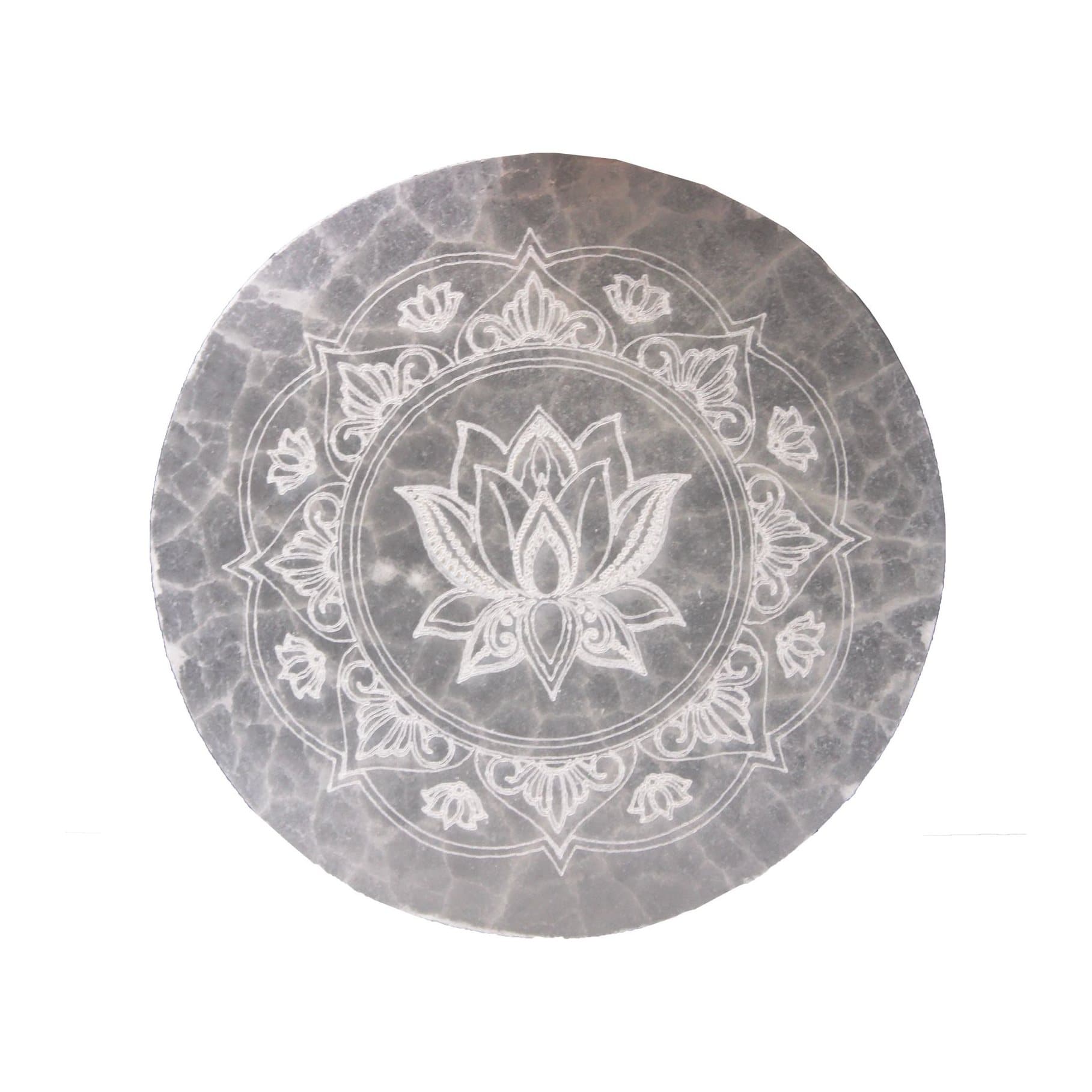 A selenite charging plate with a mandala design
