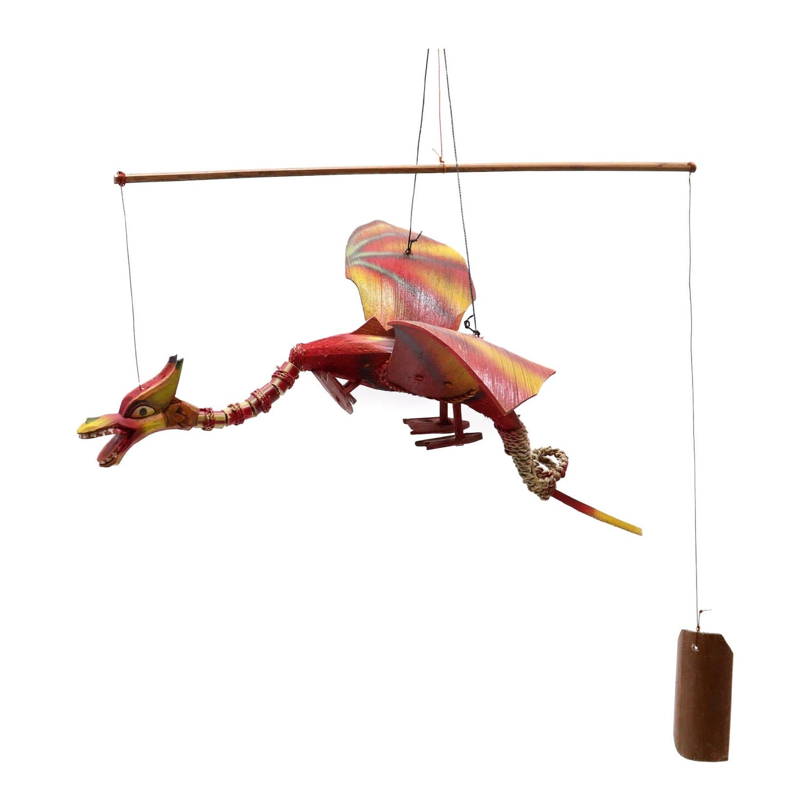 Handmade coconut dragon mobile hanging from a hook