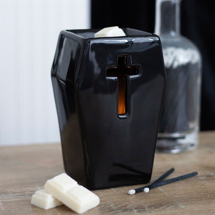 Ceramic coffin oil burner with a cut-out cross design