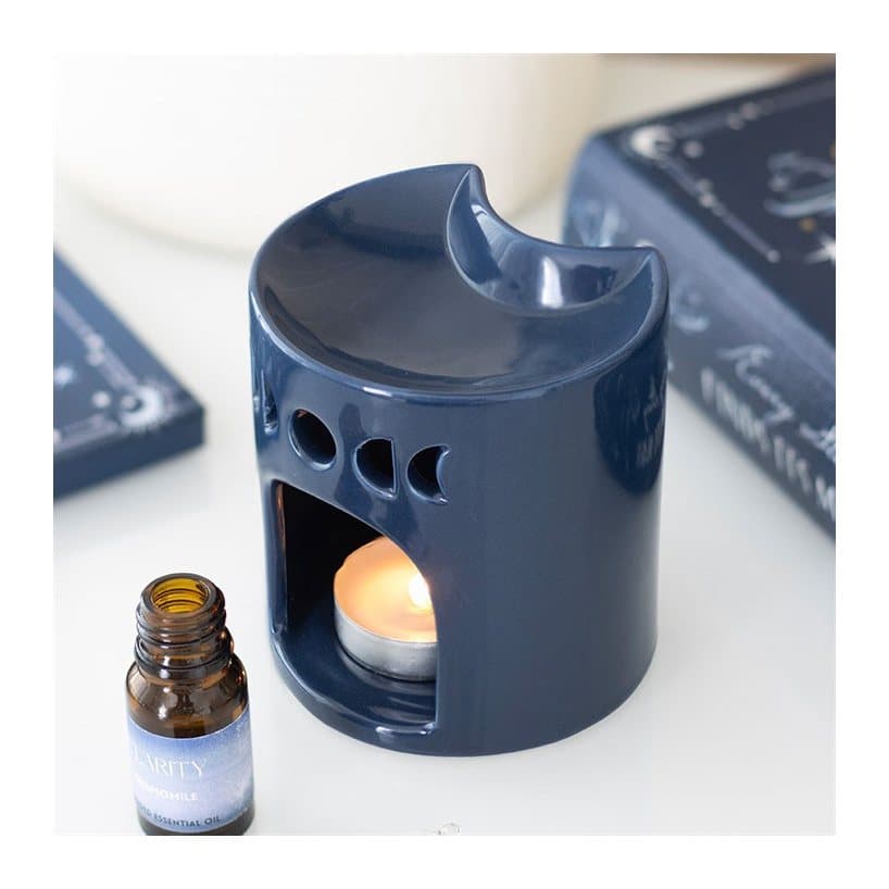 Ceramic crescent moon-shaped oil burner in blue and white