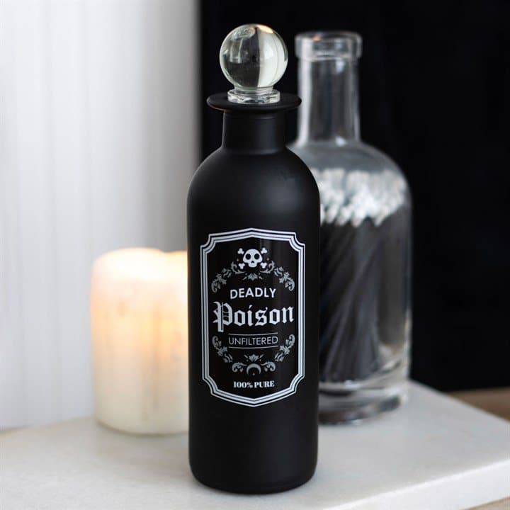 Frosted glass potion bottle with a vintage Deadly Poison label and clear glass stopper