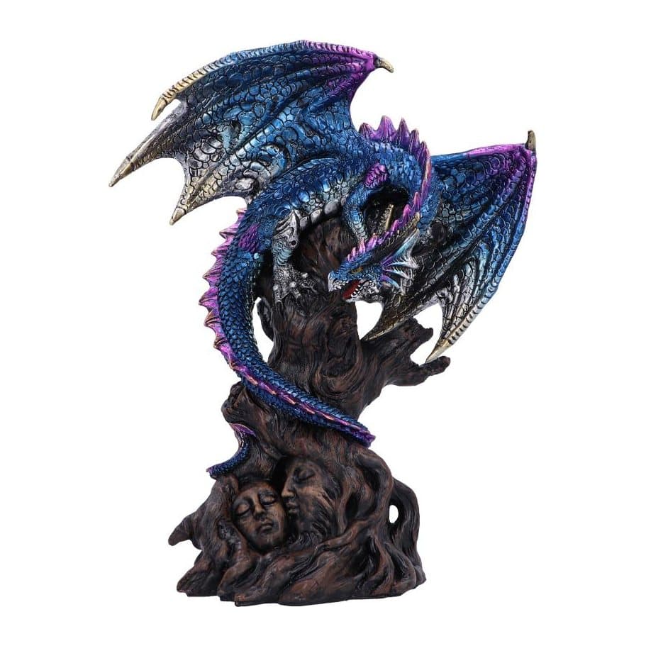 Metallic resin dragon perched on a tree trunk