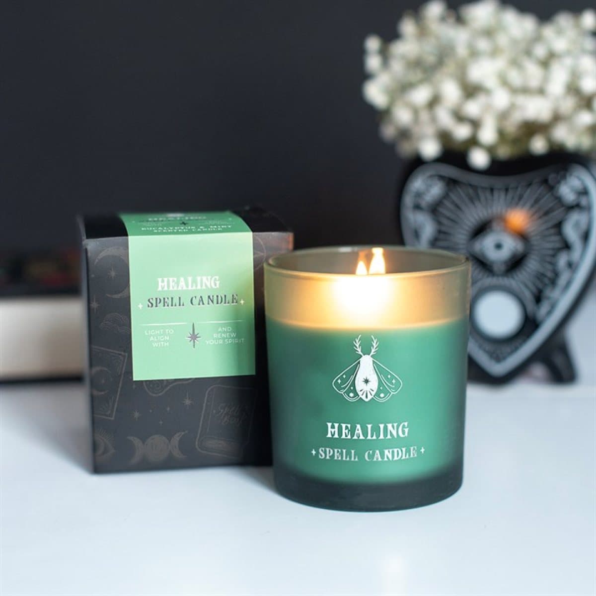 Green glass jar eucalyptus and mint scented candle with a colour cardboard box
