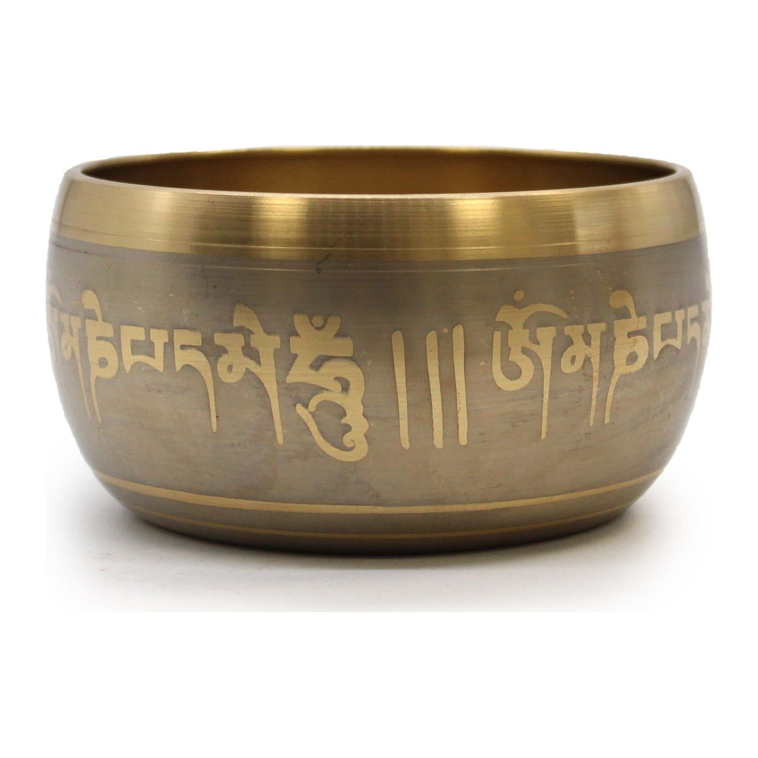Brass singing bowl with engraved Buddhist script and a brushed finish