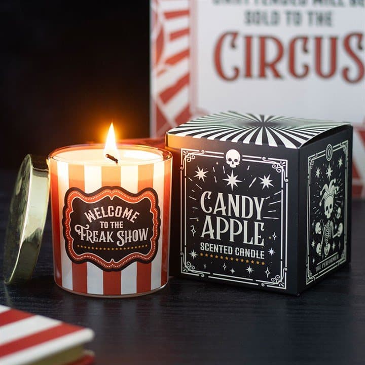 Candy Apple candle in a red and white striped jar with a Freak Show label