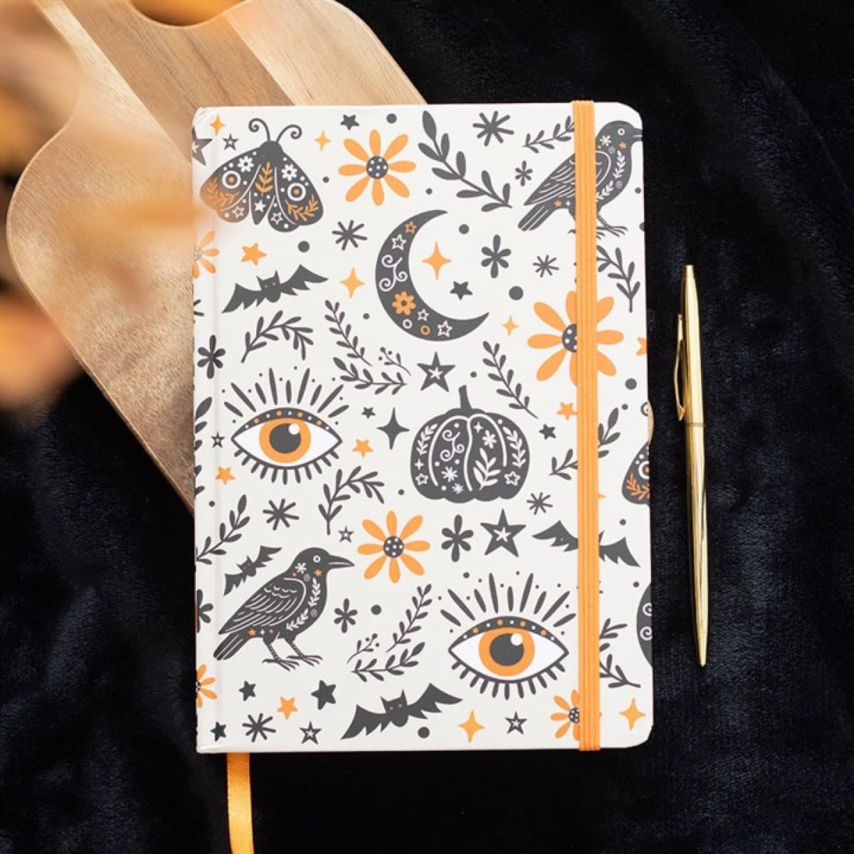 A5 notebook with a folk-inspired autumn print and elastic closure