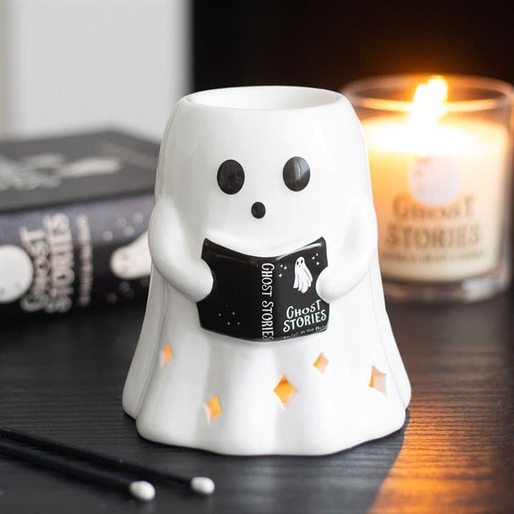 Ceramic oil burner with a ghost reading a tiny book