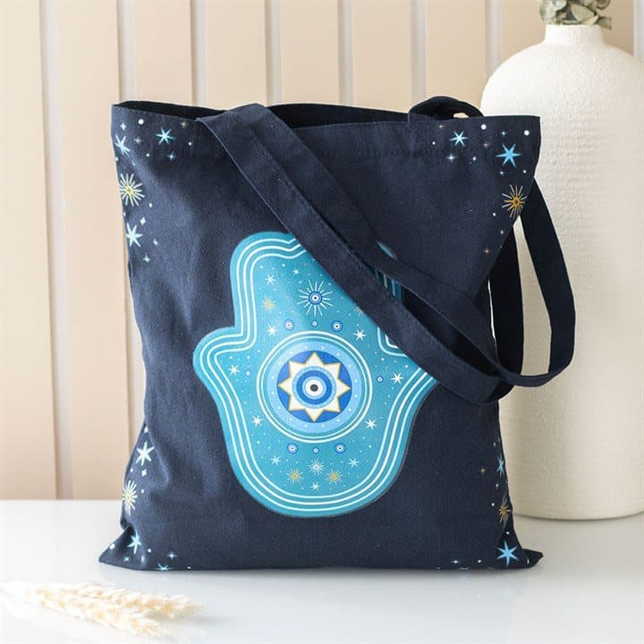 Dark blue tote bag with a Hand of Hamsa design and stars