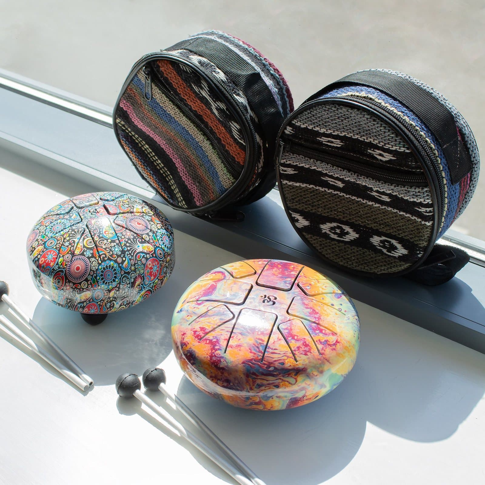 Small multi-coloured happy drum with mallets and carry bag