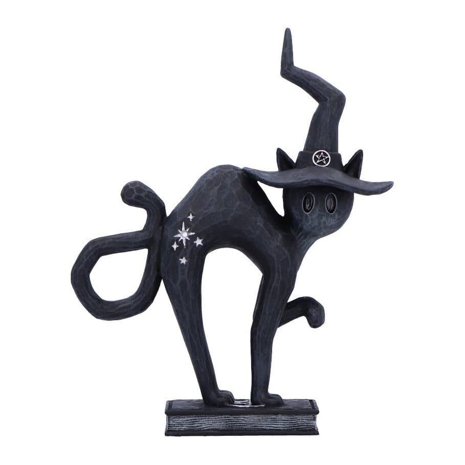 Matte black cat figurine in a pointed witch's hat on a spell book