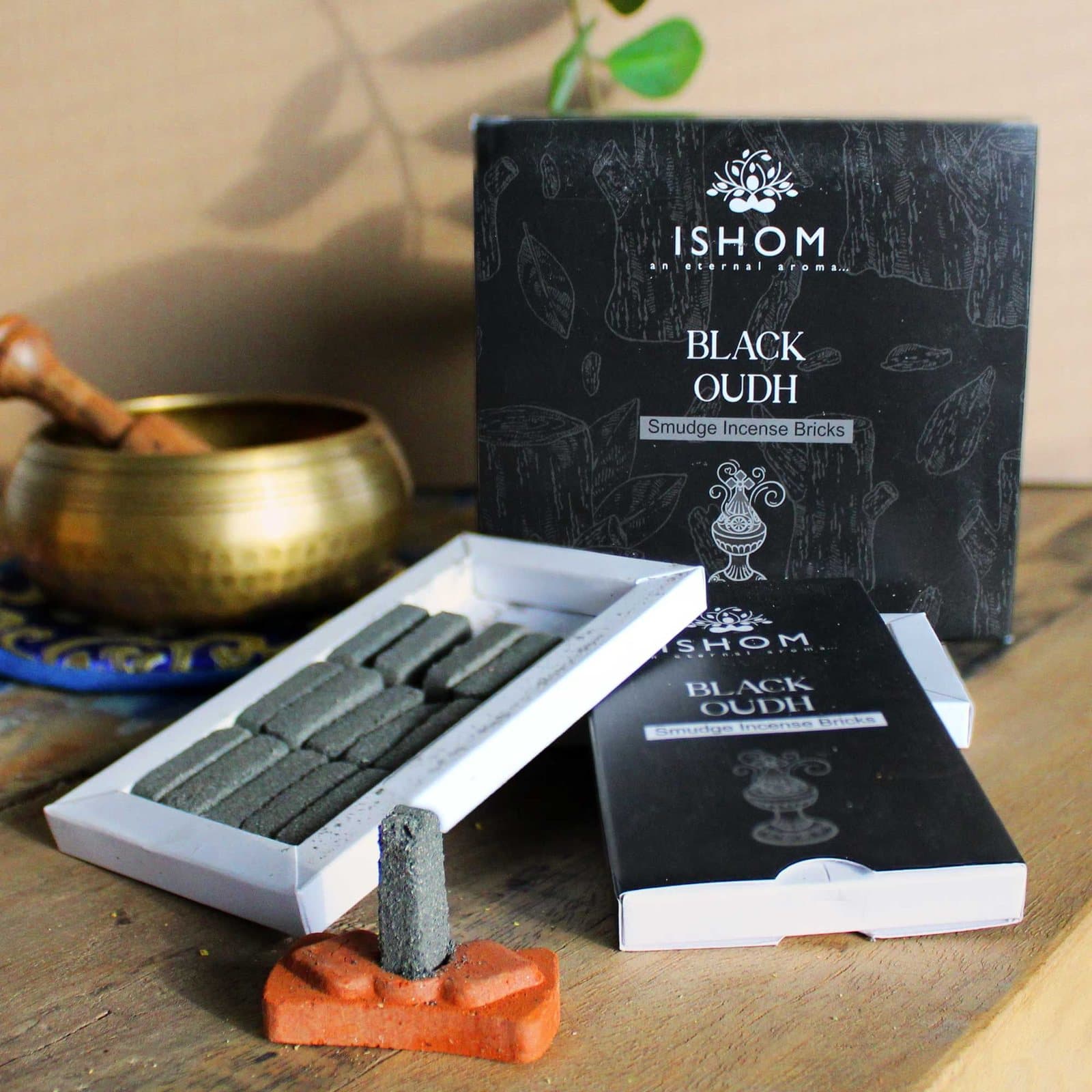 Natural incense bricks beside a terracotta holder