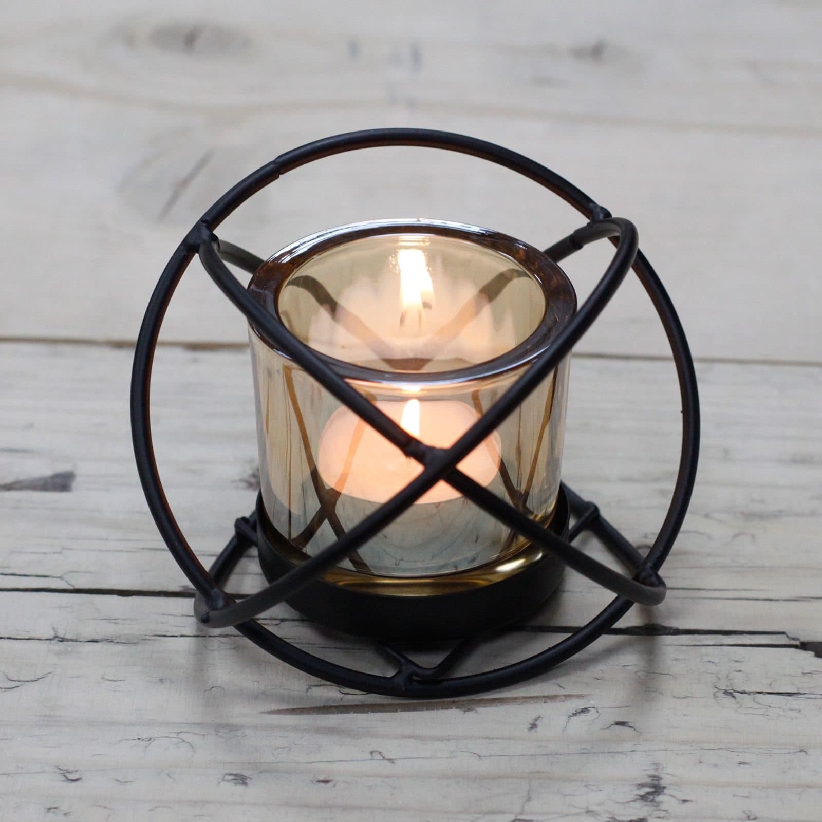Iron ball votive candle holder with a single glass cup
