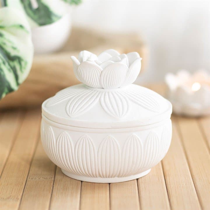 White trinket box with a detailed lotus flower lid