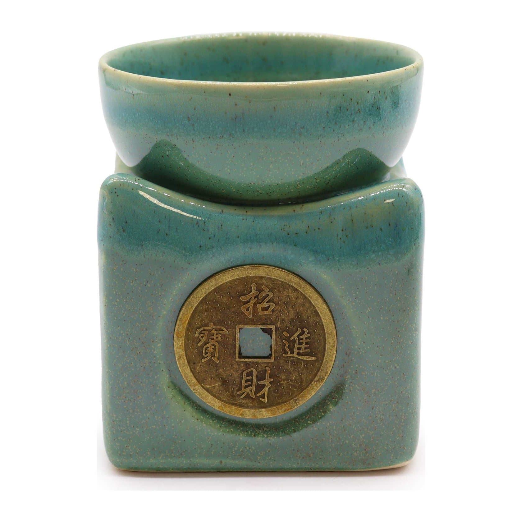 Round jade green ceramic oil burner with a lucky coin motif