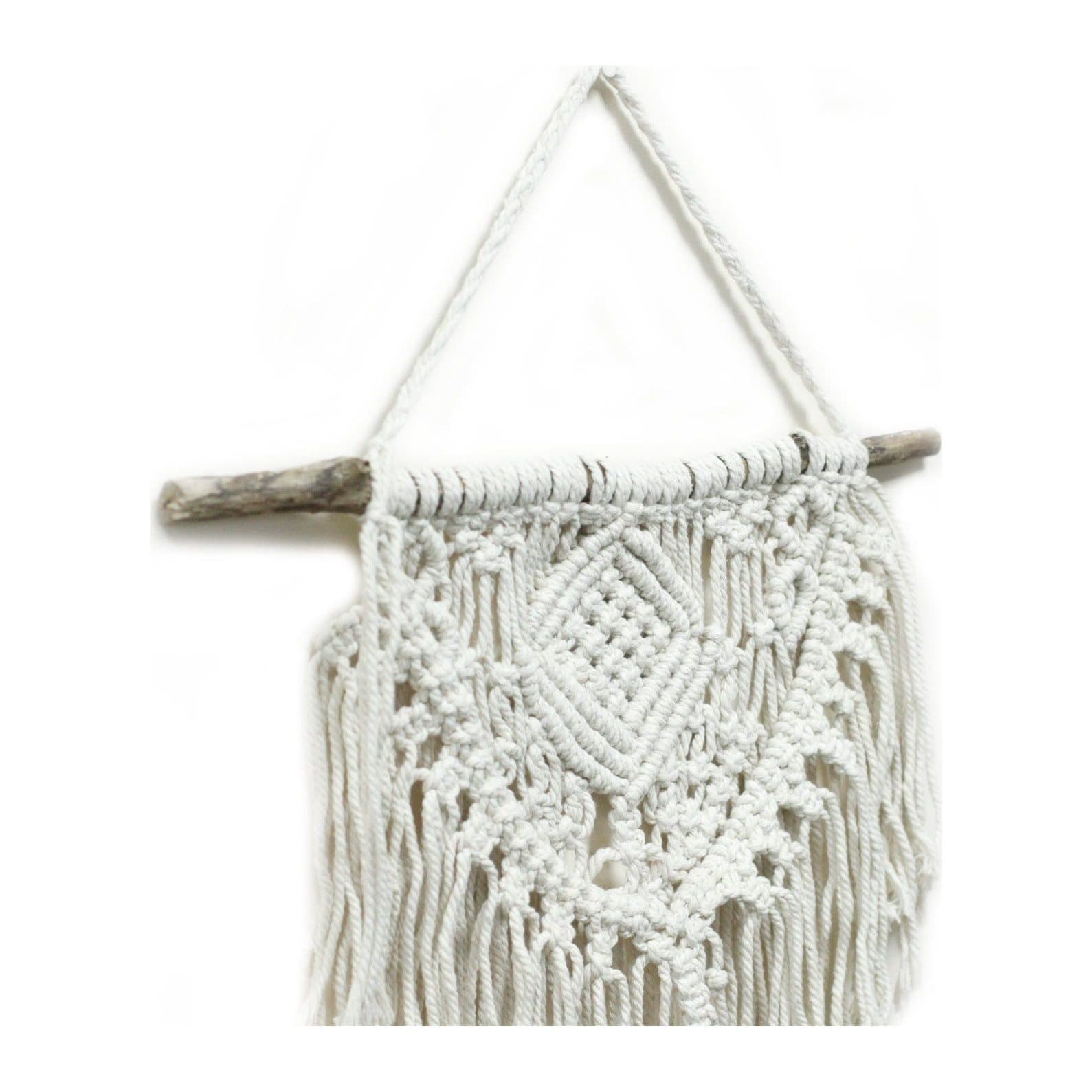 Cotton macrame wall hanging with a knotted boho pattern