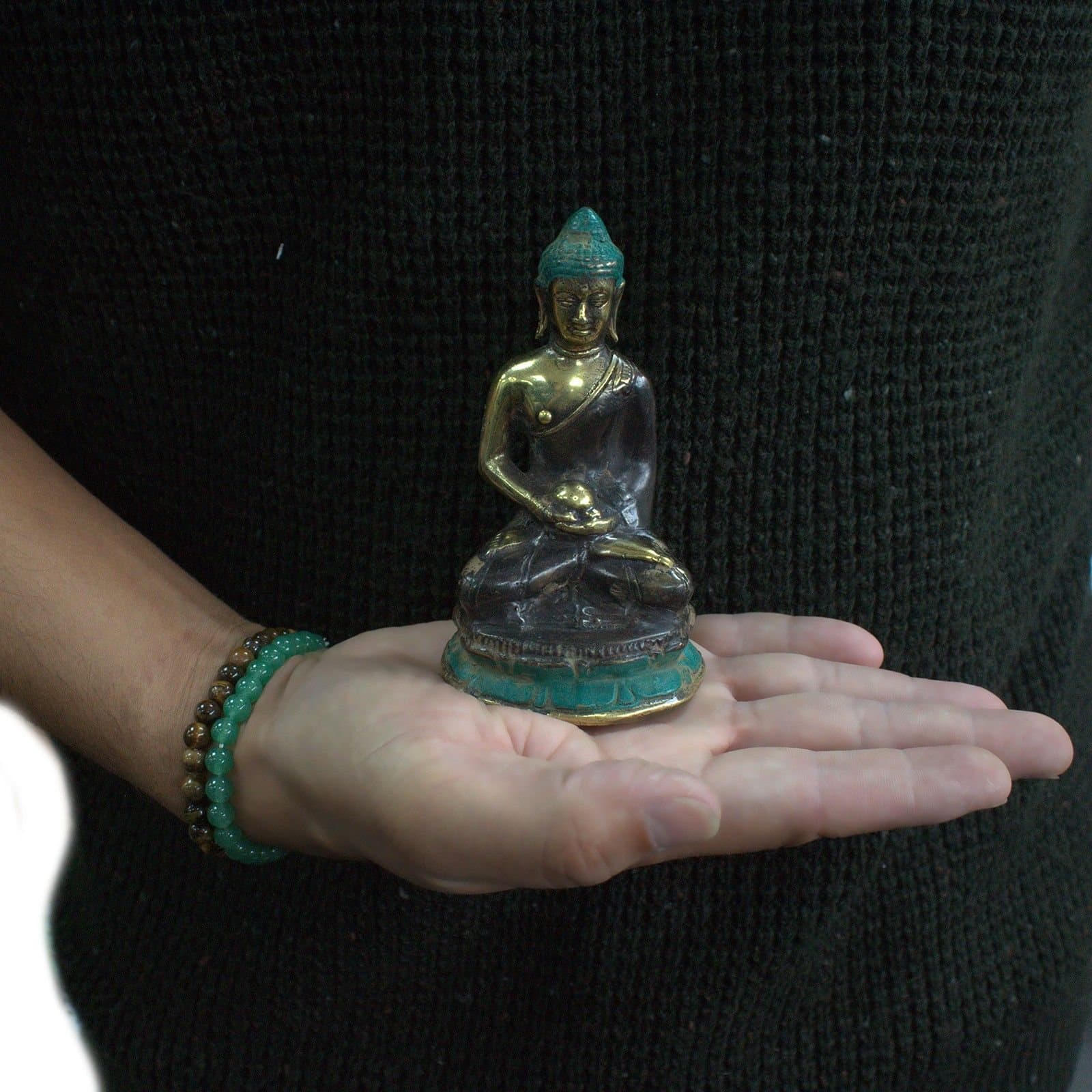 Handmade brass sitting Buddha statue in neutral tones