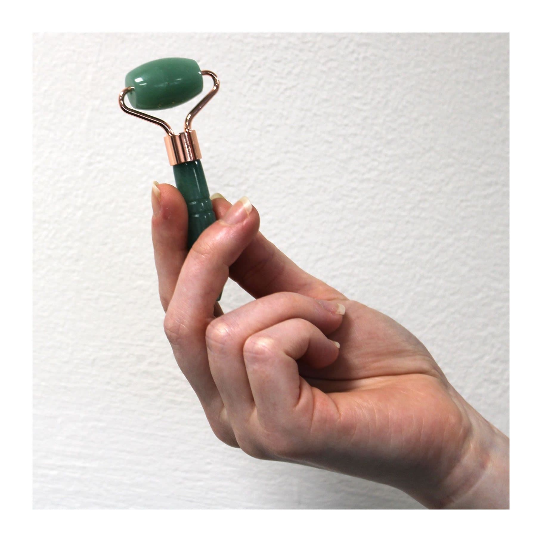 Mini gemstone face roller with a polished stone roller head