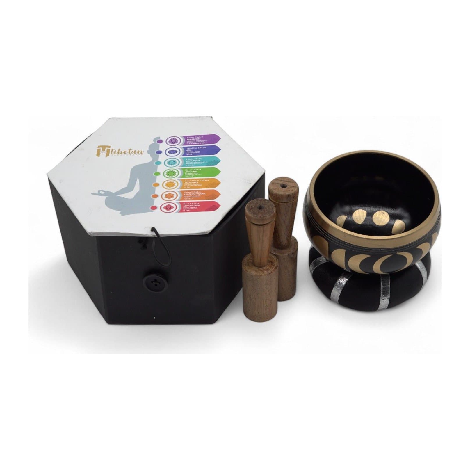 Black singing bowl with moon phase motifs, wooden striker and ring cushion