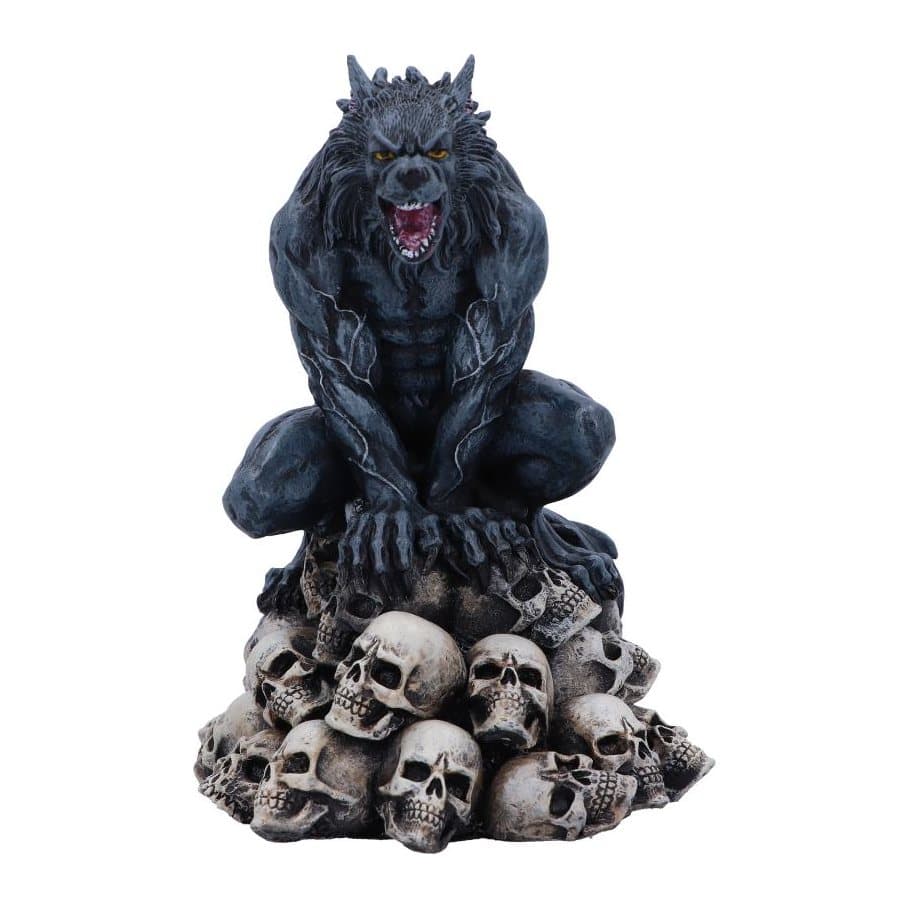 Hand-painted resin werewolf with gnarled teeth crouched on a pile of skulls