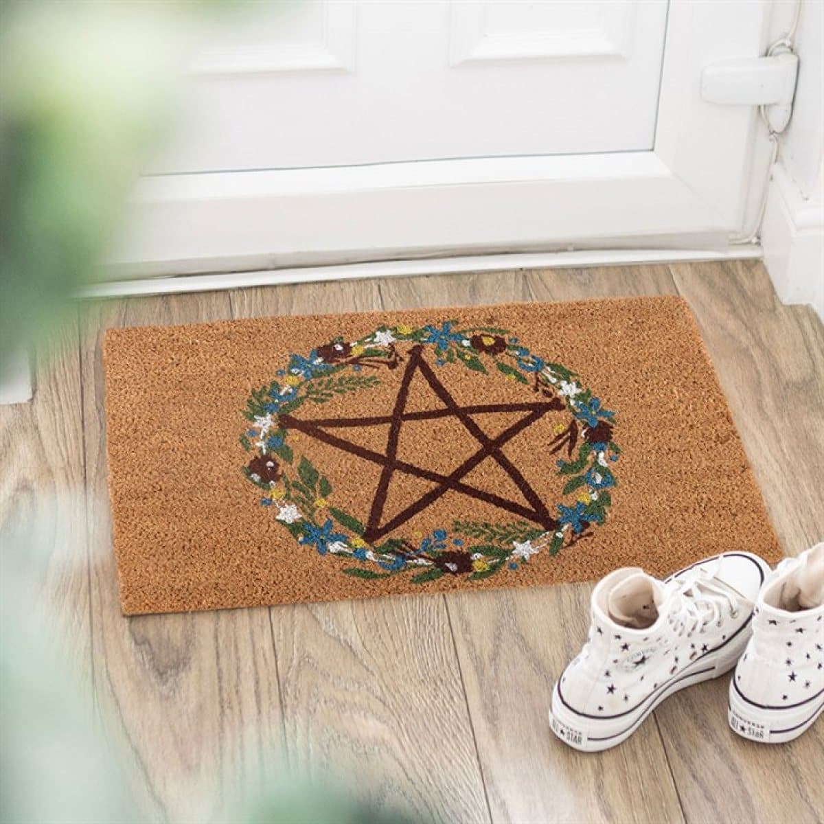 Natural coir doormat with a pentagram inside a floral wreath