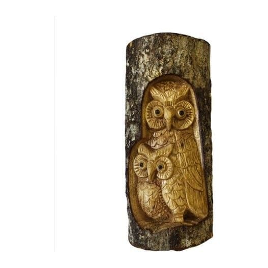 Wooden owl tree trunk carving with a carved 'Man of the Wood' face