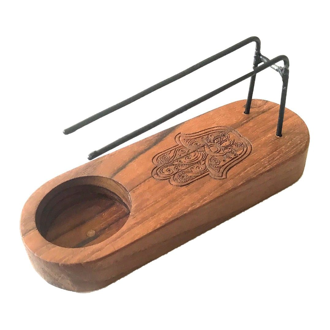 Teak wood and metal palo santo heater with a hamsa design
