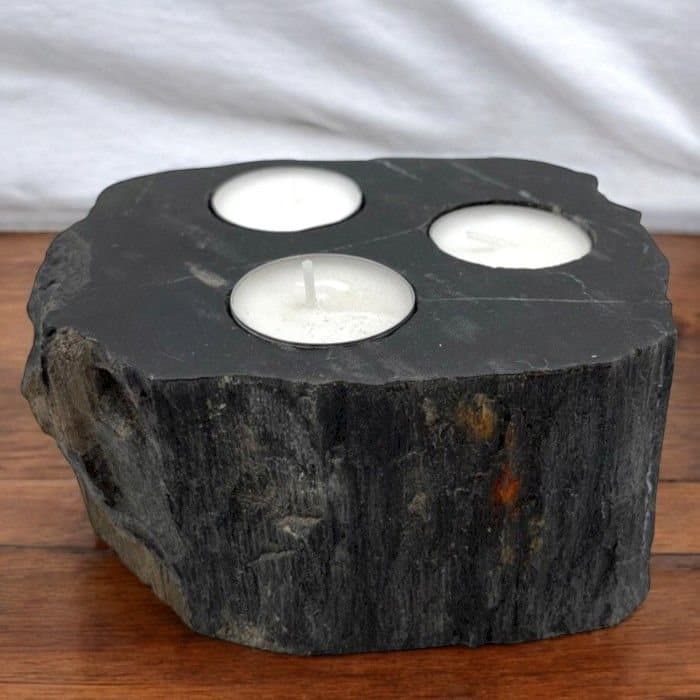 Hand-carved petrified wood tealight holder with rustic texture