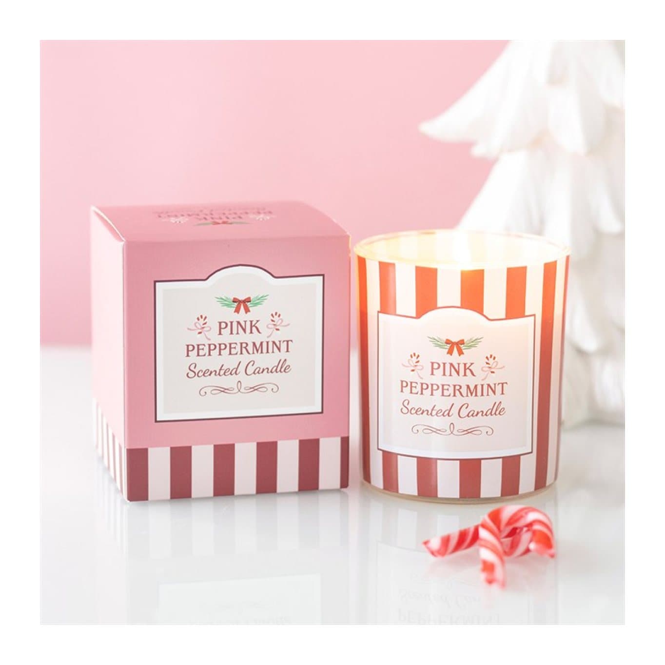 Pink peppermint scented glass candle in a pink and red striped box