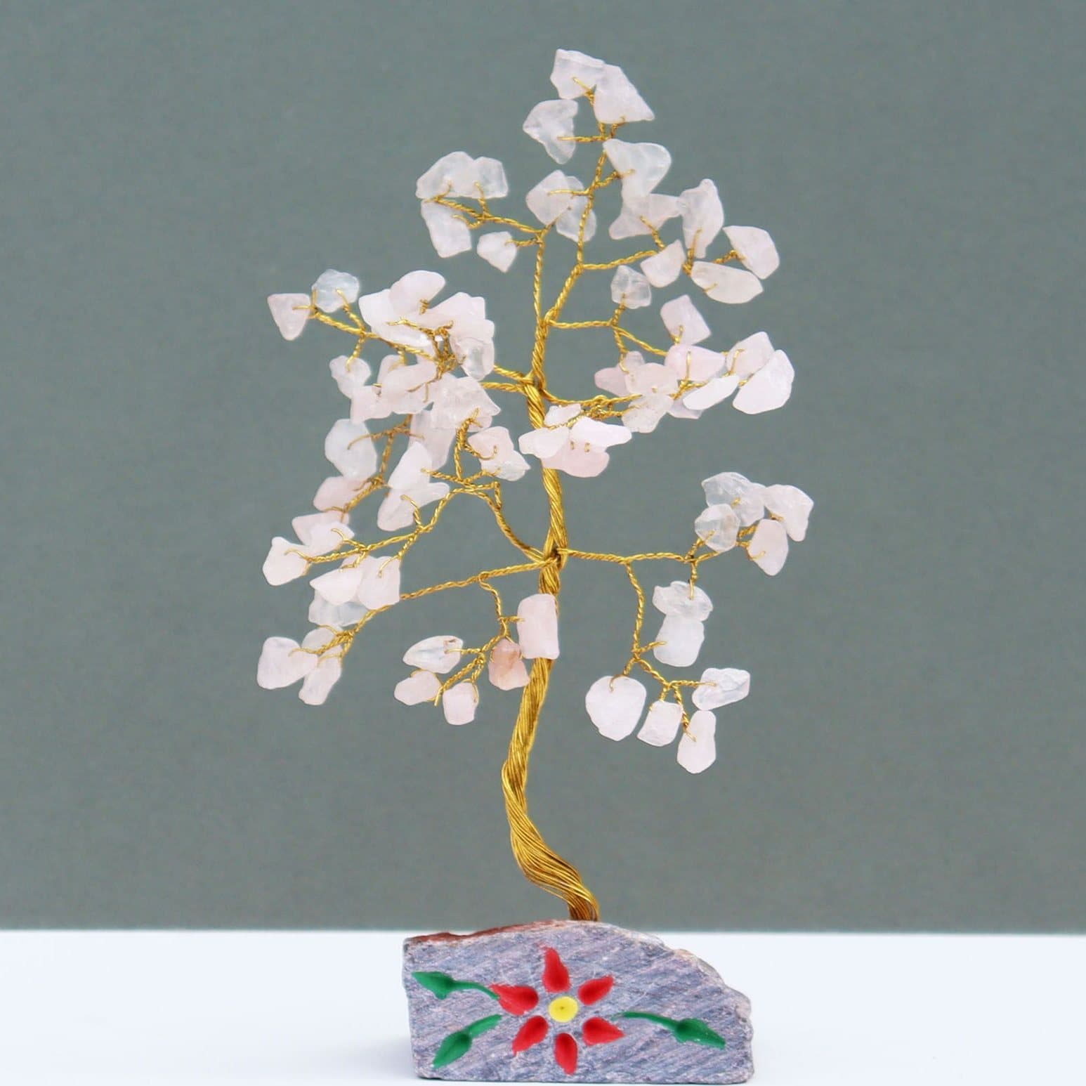 Rose quartz gemstone tree on a gemstone rock base