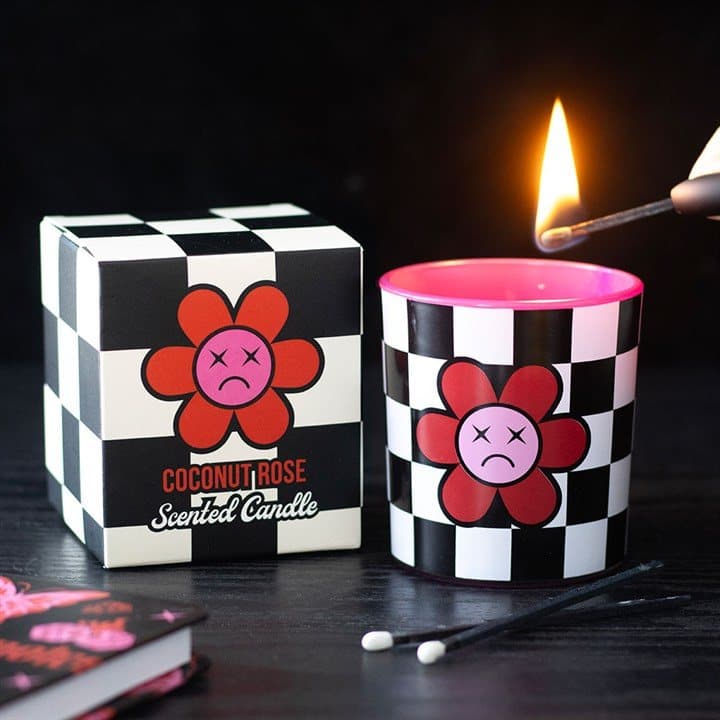 Checkerboard candle with a sad flower design
