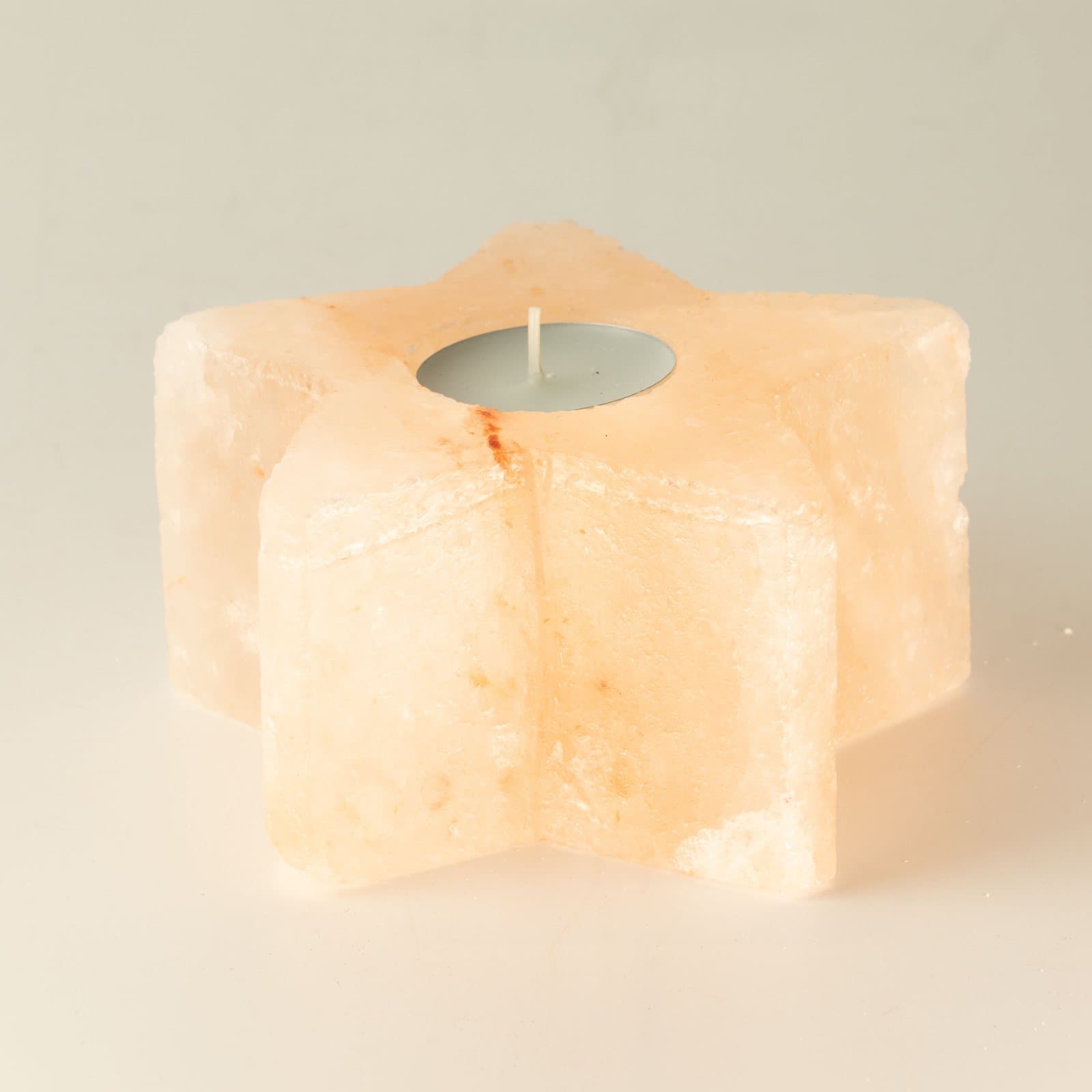 Himalayan salt candle holder in natural pink crystal salt rock
