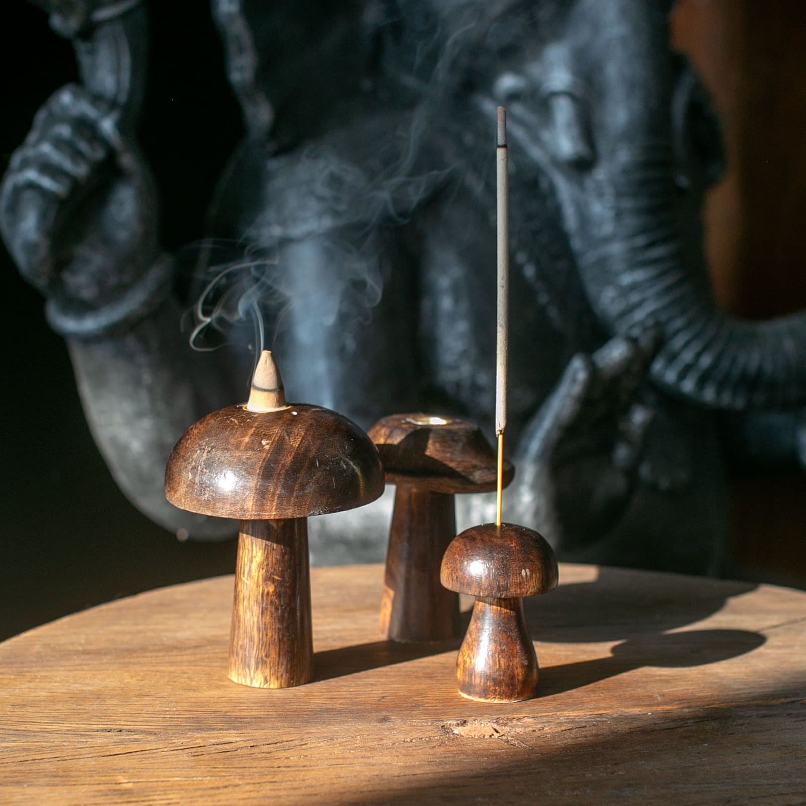 Three mango wood mini mushroom incense holders in three heights