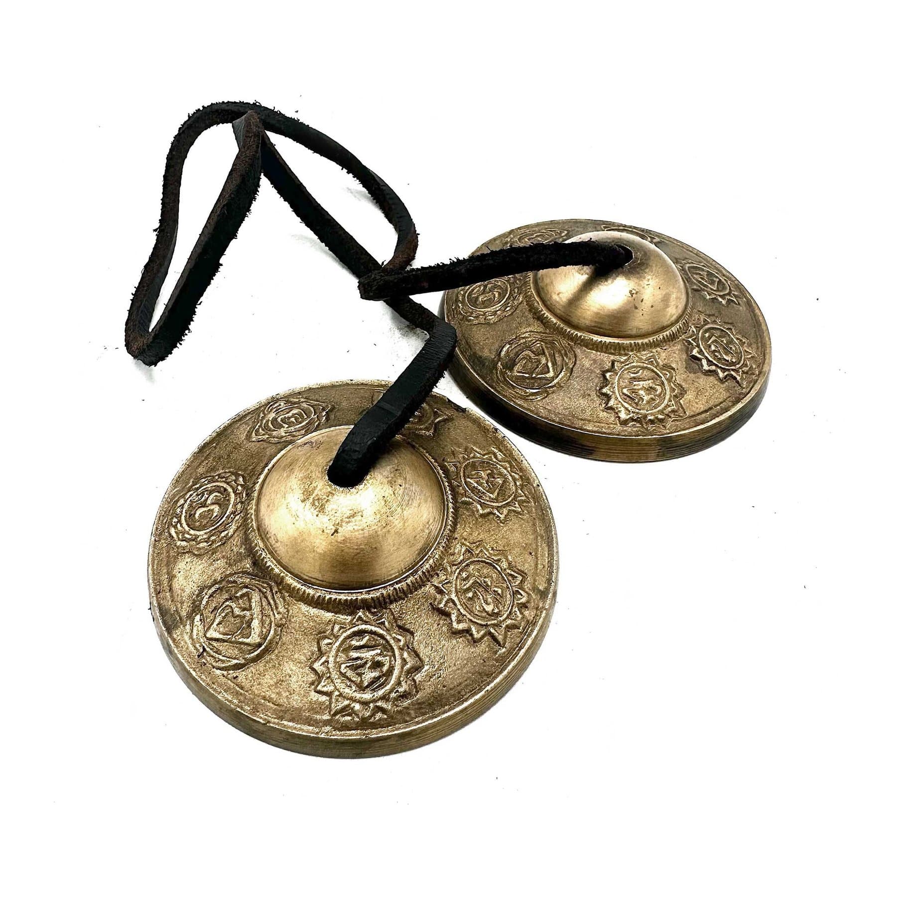Brass Tibetan tingsha bells engraved with the seven chakra symbols