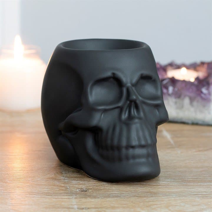 Matt ceramic skull oil burner in black or white