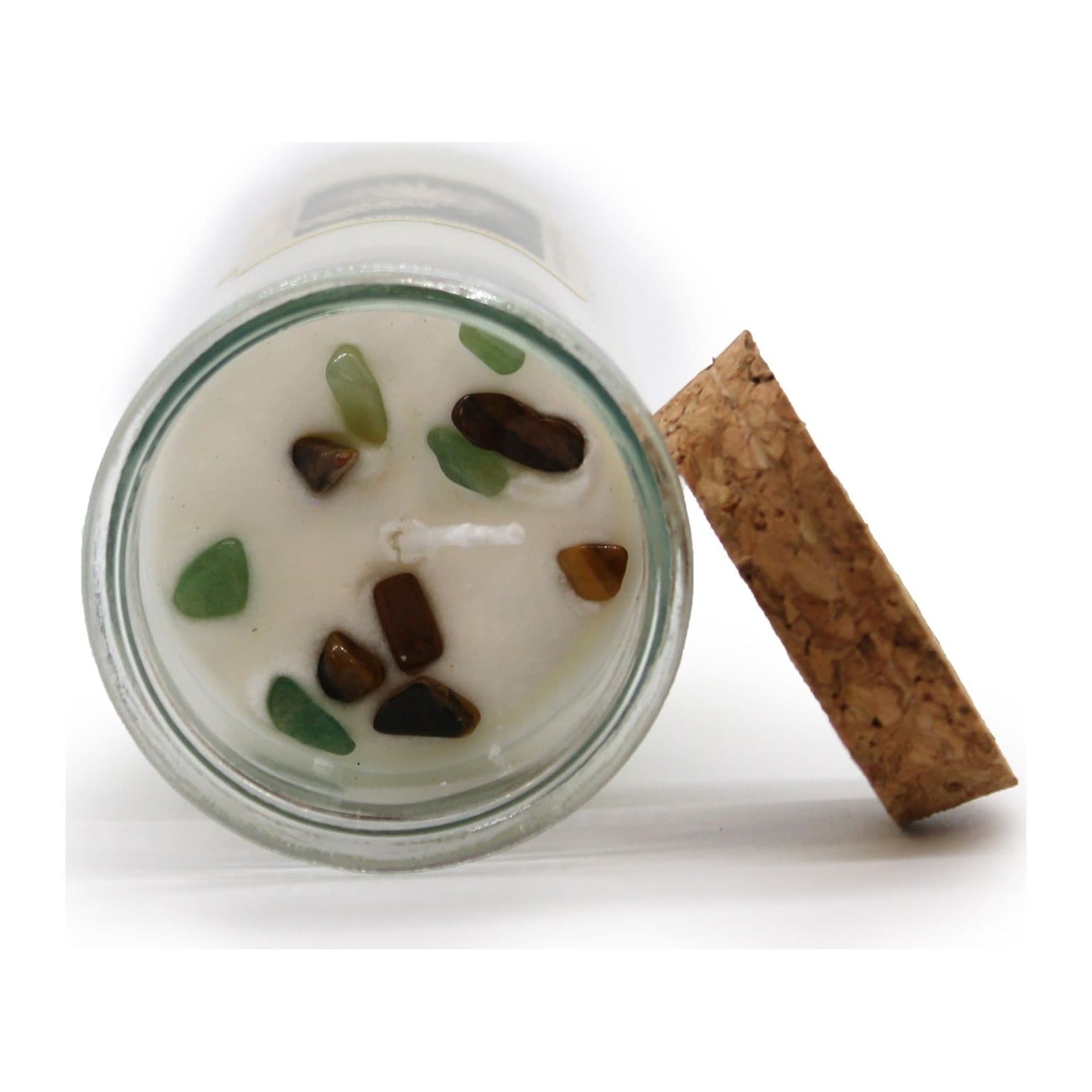 Soy wax spell candle in a tall glass tube with gemstones in the wax