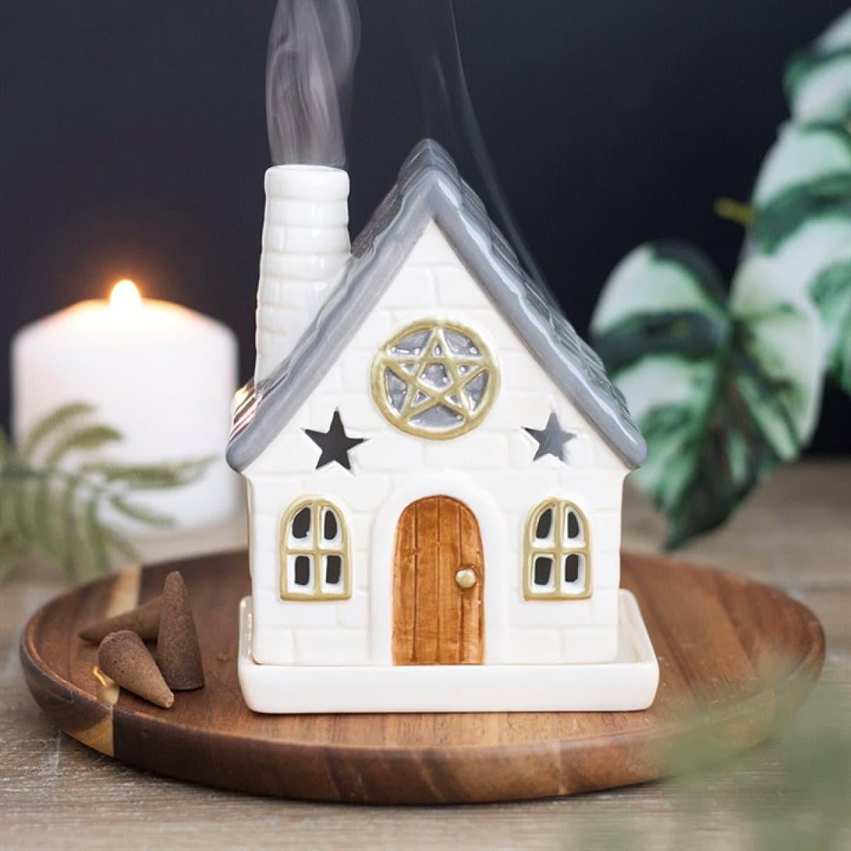 Ceramic stone cottage incense cone holder with a chimney and star accents