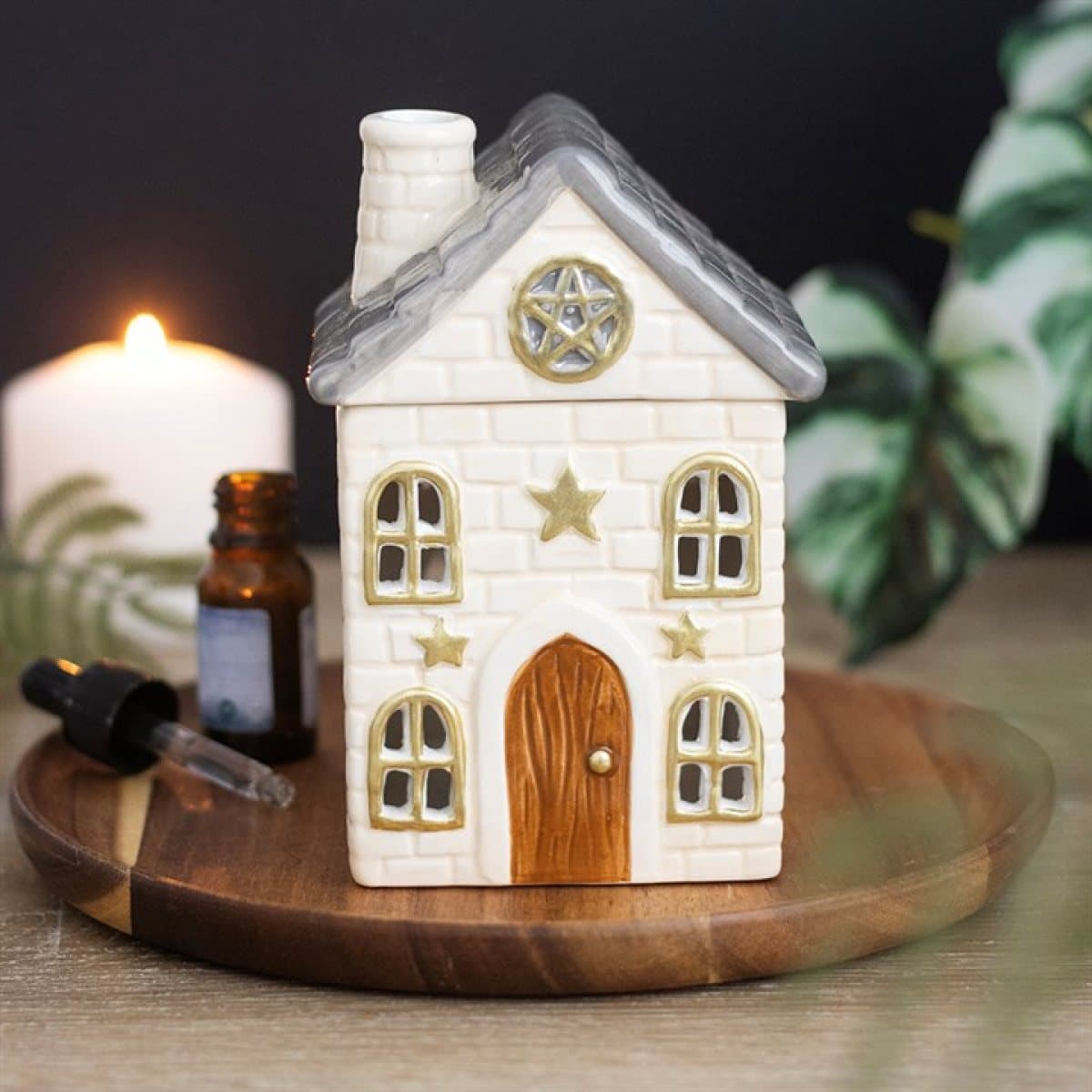 Ceramic Stone Cottage oil burner with cottage details and star accents