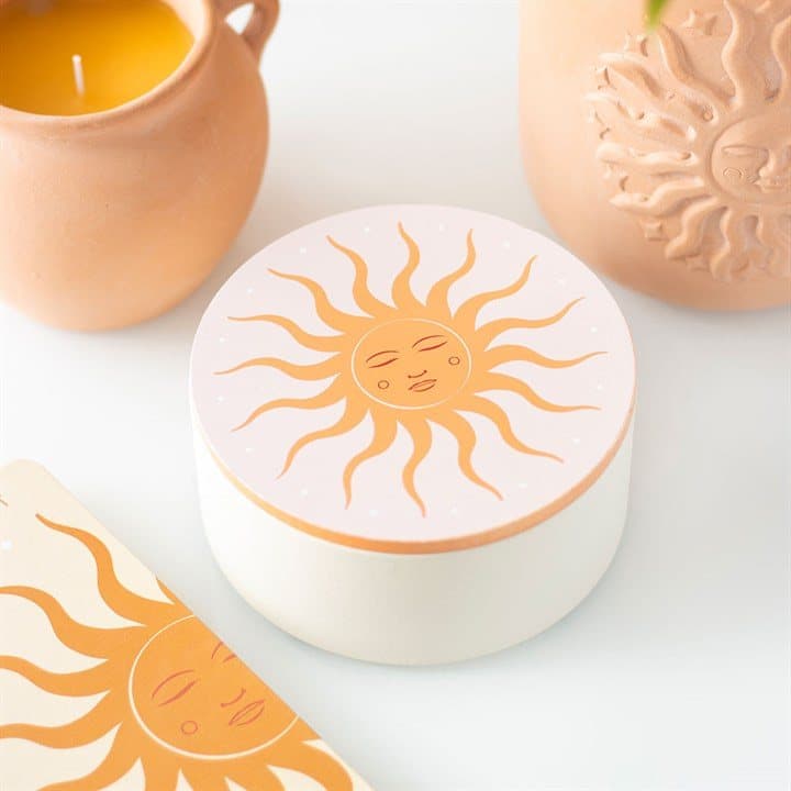White jewellery box with a sun design and a mirror in the lid