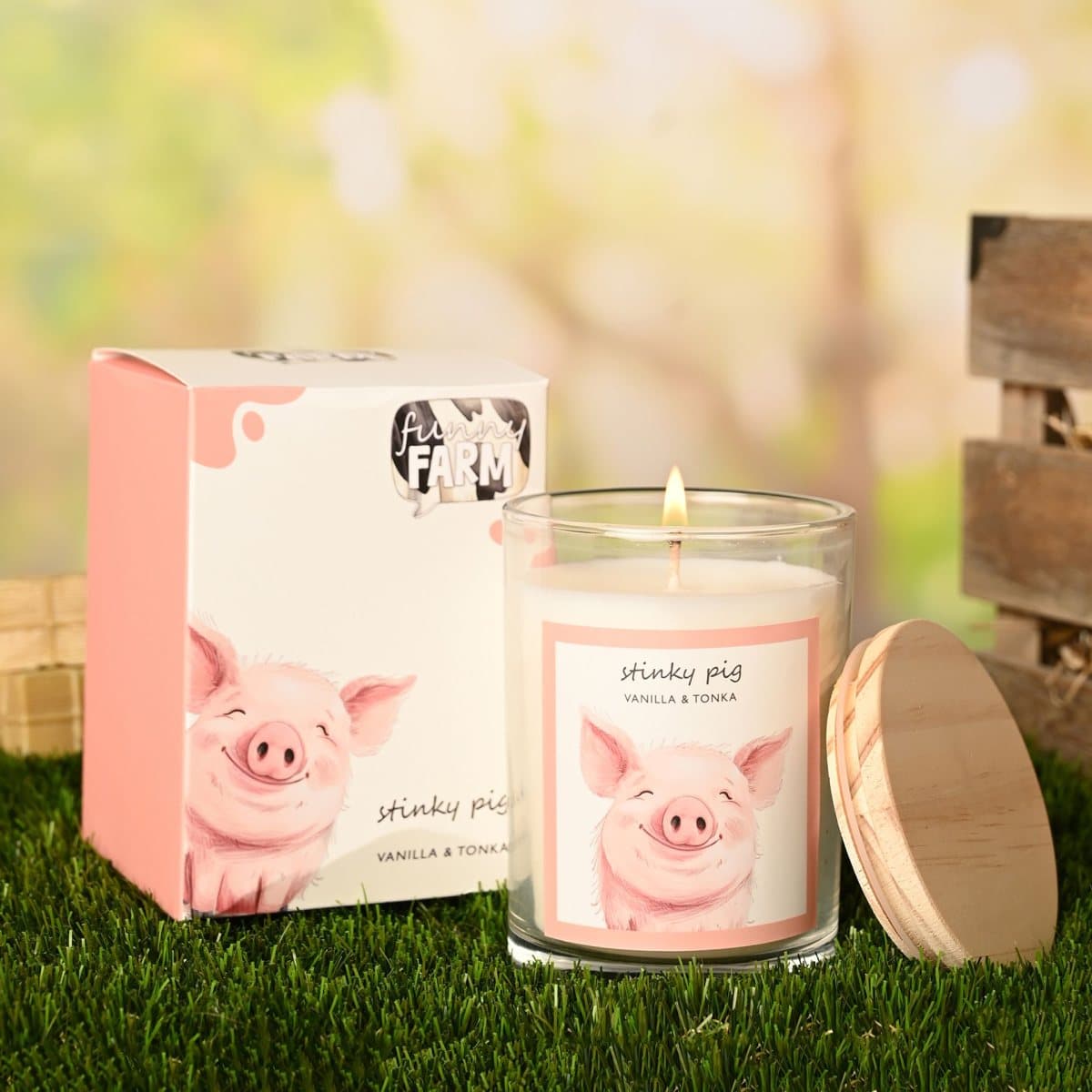 Funny Farm Stinky Pig candle in a glass jar with matching packaging