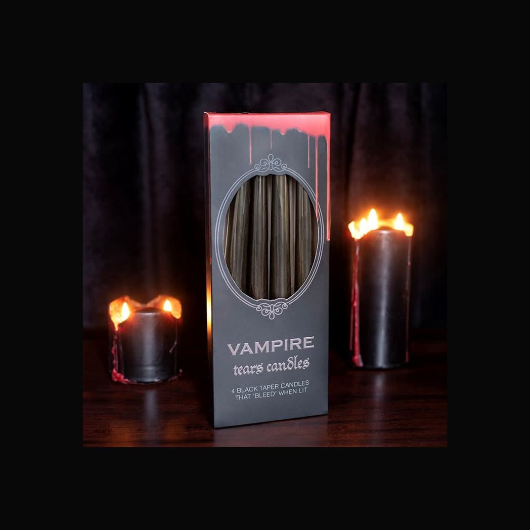 Four black Vampire Tears candles with red melting wax
